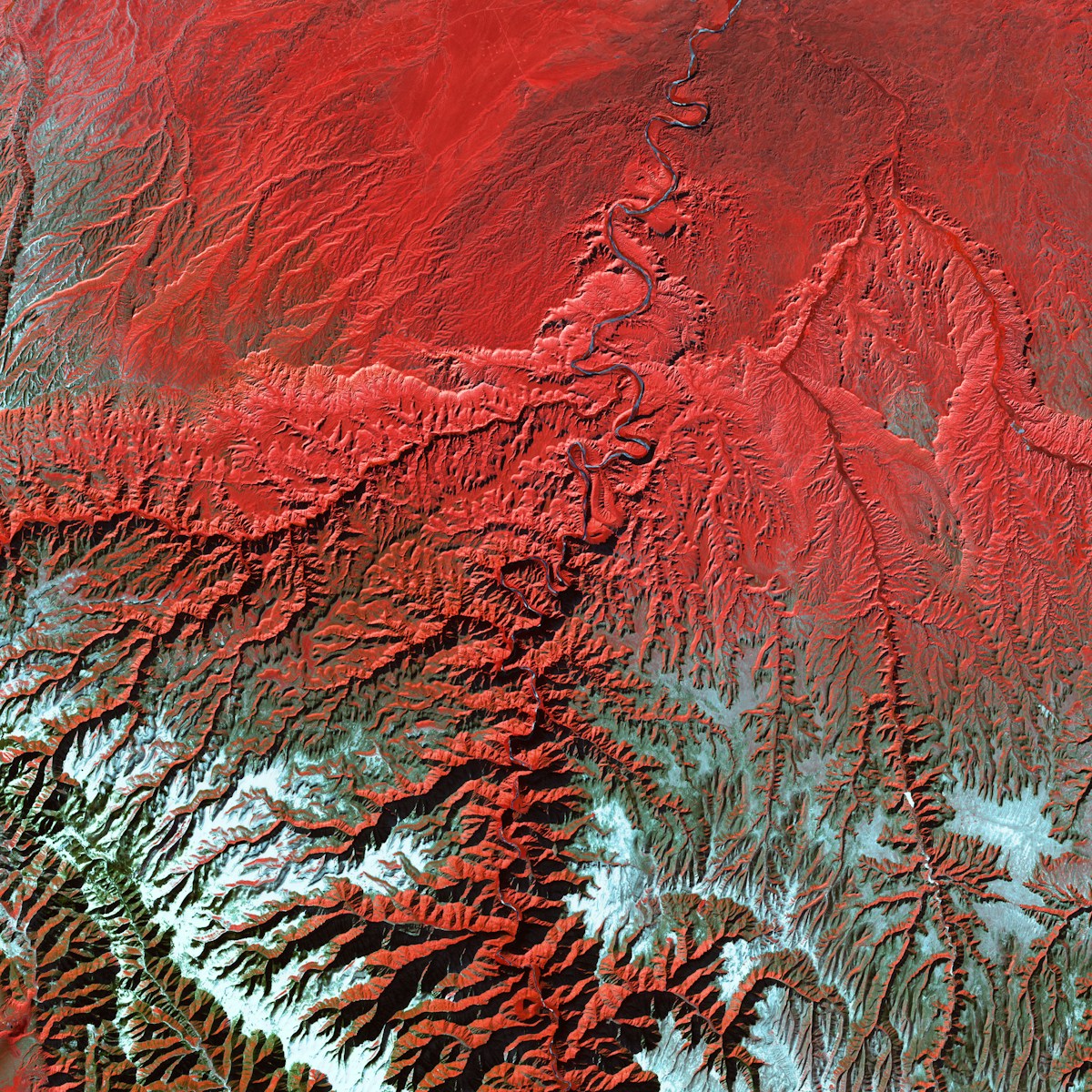 a satellite image of a red mountain range